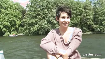 Watch this natural-titted amateur babe finger herself on a boat, then masturbate in public!